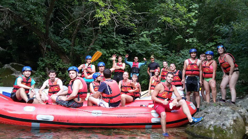 ESS activity group photo on the river with rafts.